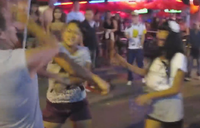Thai woman punches man